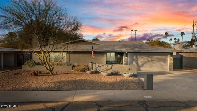 single story home featuring driveway and an attached garage