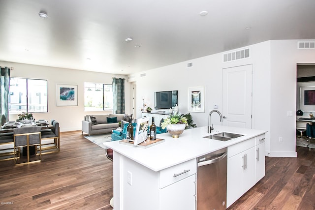 kitchen with stainless steel dishwasher, sink, dark hardwood / wood-style floors, and a kitchen island with sink