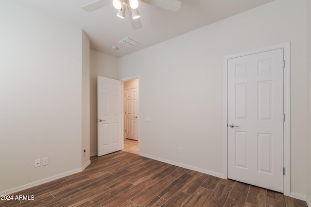 unfurnished bedroom featuring ceiling fan