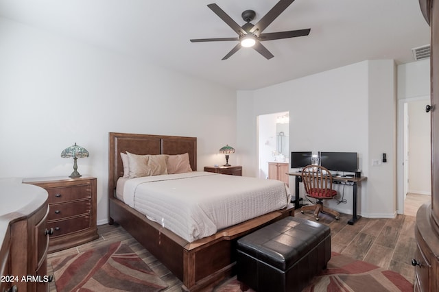 bedroom featuring ensuite bath and ceiling fan