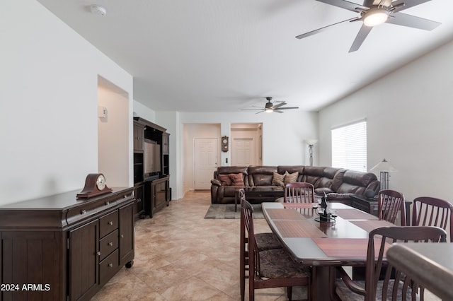 dining room featuring ceiling fan