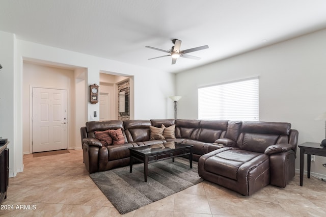 living room featuring ceiling fan and light tile patterned floors