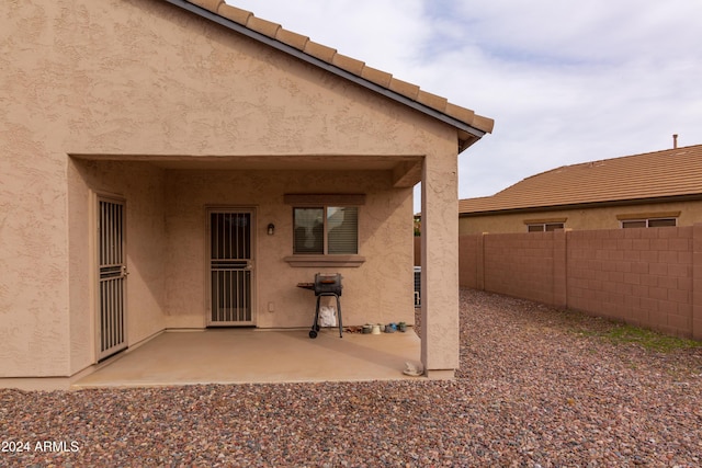 property entrance with a patio area