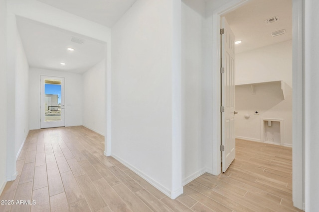 corridor featuring wood finish floors, visible vents, and recessed lighting