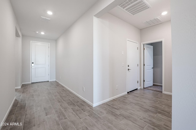 hallway featuring light hardwood / wood-style flooring