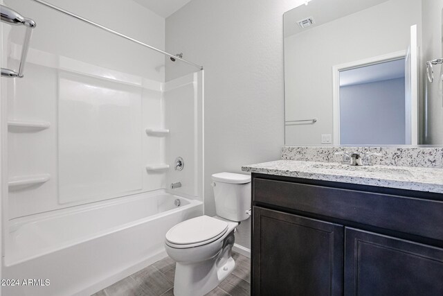 full bathroom featuring vanity, toilet, shower / tub combination, and hardwood / wood-style floors