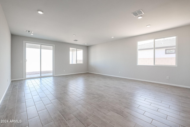 empty room with light hardwood / wood-style floors