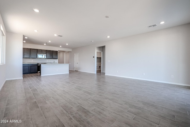 unfurnished living room featuring light hardwood / wood-style floors