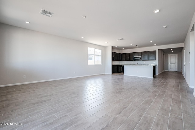 unfurnished living room featuring light hardwood / wood-style floors