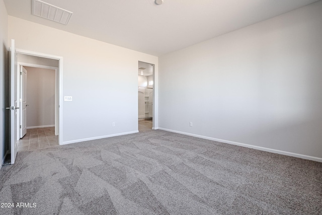 unfurnished bedroom with light carpet