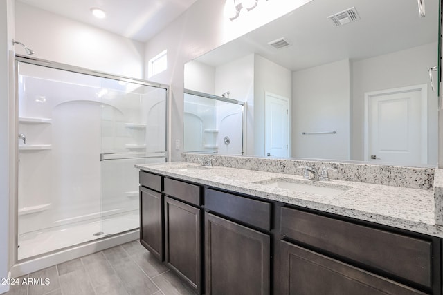 bathroom featuring vanity and walk in shower