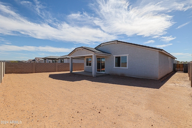 rear view of property with a patio area