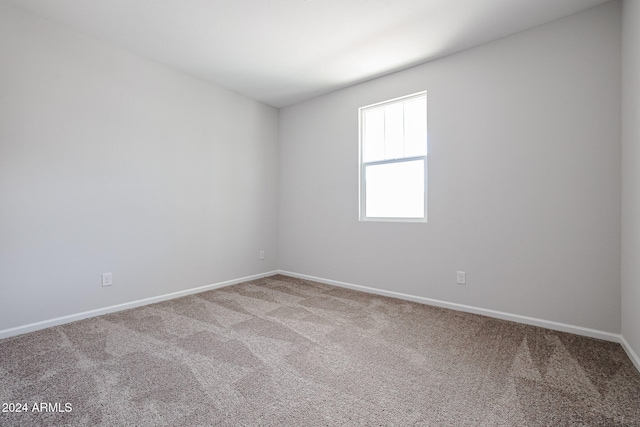 empty room featuring carpet flooring