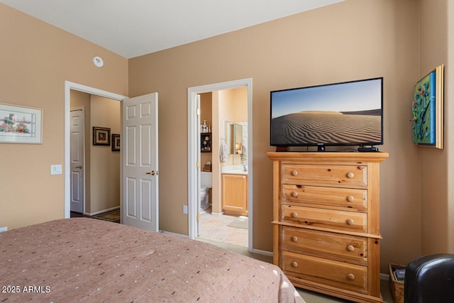 bedroom featuring connected bathroom