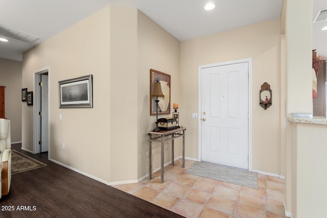 entryway with light tile patterned floors