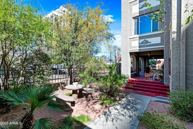 exterior space with a porch and fence