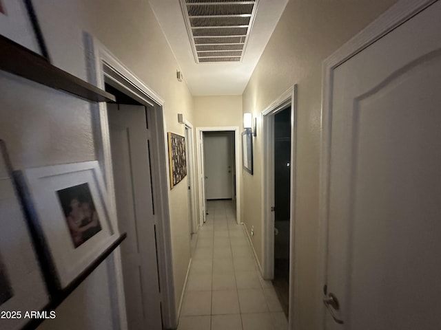 hallway featuring light tile patterned floors