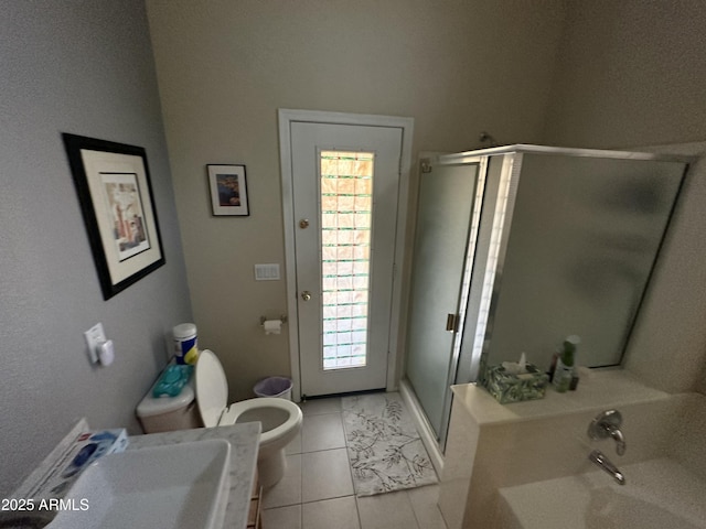 bathroom with plenty of natural light, sink, tile patterned floors, and a shower with shower door