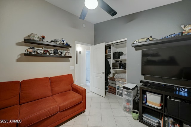 tiled living room featuring ceiling fan