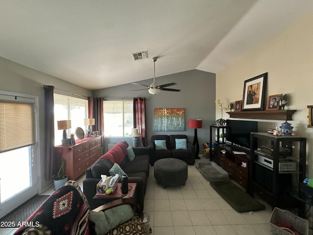 tiled living room featuring vaulted ceiling and ceiling fan