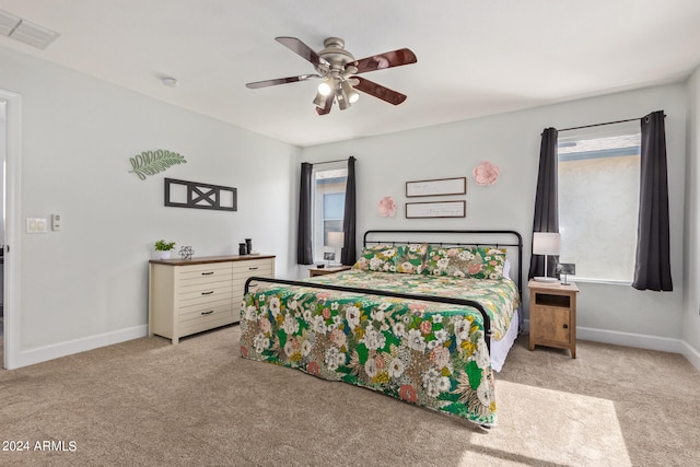 carpeted bedroom with ceiling fan