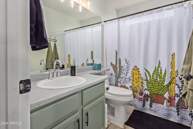 bathroom featuring curtained shower, vanity, and toilet