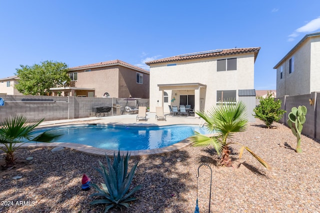 view of pool featuring a patio