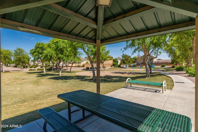 view of community with a lawn, a patio, and a gazebo