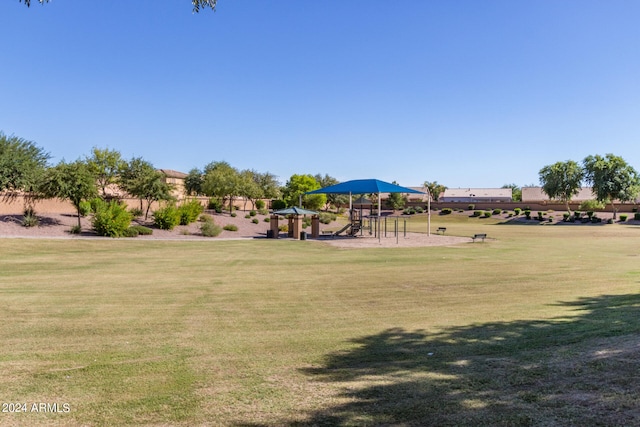 view of playground with a lawn