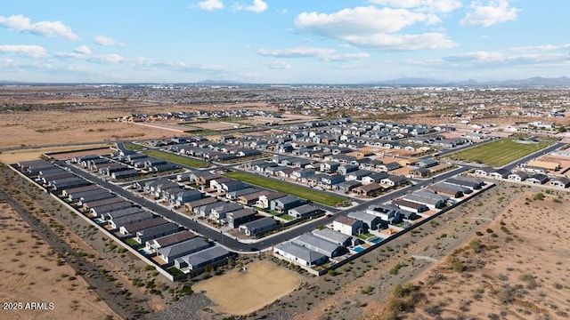 birds eye view of property with a residential view