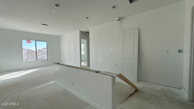 unfurnished room with visible vents