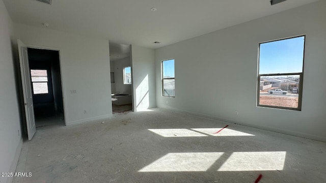 unfurnished bedroom with multiple windows