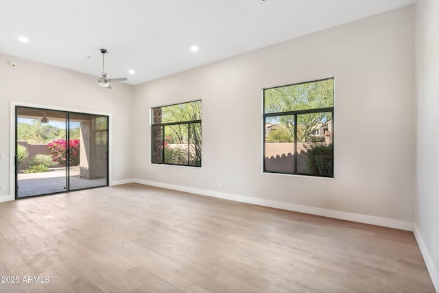 19550 N Grayhawk Dr Unit 1144, Scottsdale, AZ 85255 - spare room featuring healthy amount of natural light, recessed lighting, light wood-style flooring, and a ceiling fan