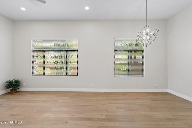 19550 N Grayhawk Dr Unit 1144, Scottsdale, AZ 85255 - unfurnished room with healthy amount of natural light, light wood-style flooring, and recessed lighting