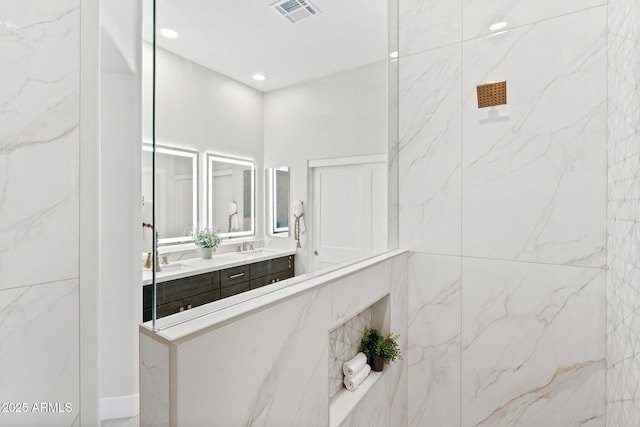 19550 N Grayhawk Dr Unit 1144, Scottsdale, AZ 85255 - full bath with double vanity, a marble finish shower, and recessed lighting