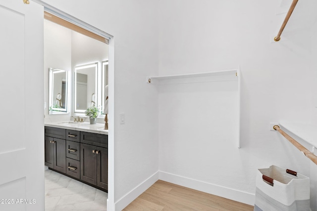 19550 N Grayhawk Dr Unit 1144, Scottsdale, AZ 85255 - bathroom featuring double vanity and wood finished floors
