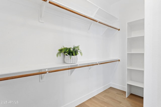19550 N Grayhawk Dr Unit 1144, Scottsdale, AZ 85255 - walk in closet featuring light wood-style flooring