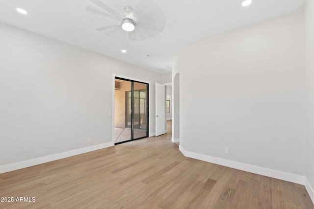 19550 N Grayhawk Dr Unit 1144, Scottsdale, AZ 85255 - spare room featuring light wood finished floors, recessed lighting, ceiling fan, and arched walkways