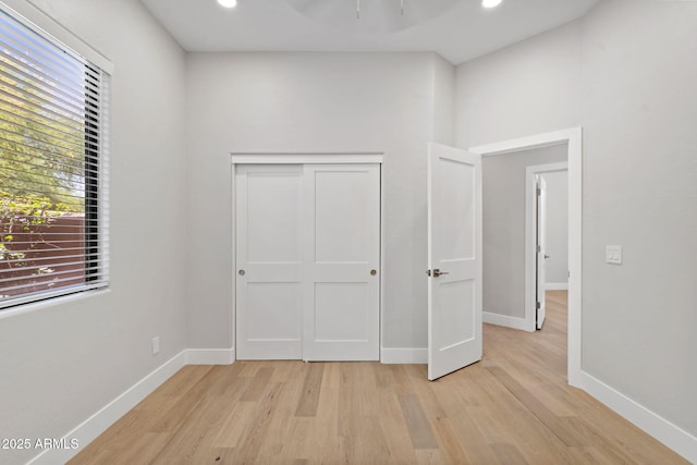 19550 N Grayhawk Dr Unit 1144, Scottsdale, AZ 85255 - unfurnished bedroom featuring light wood finished floors, recessed lighting, and a closet