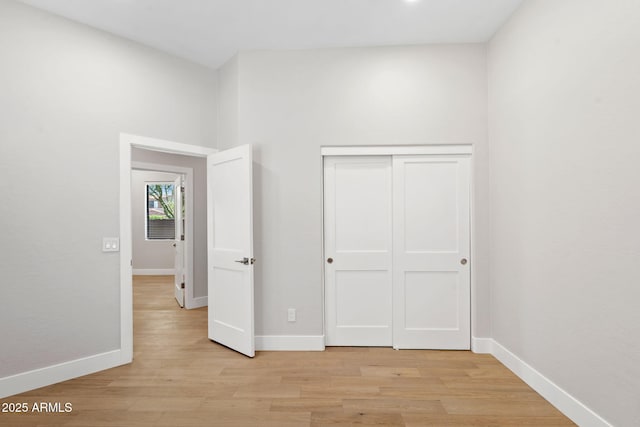 19550 N Grayhawk Dr Unit 1144, Scottsdale, AZ 85255 - unfurnished bedroom with light wood finished floors and a closet