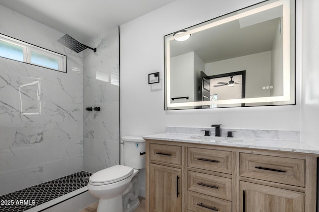 3802 N 48th Dr, Phoenix, AZ 85031 - full bath featuring a marble finish shower, ceiling fan, vanity, and toilet