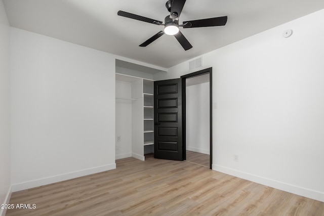 3802 N 48th Dr, Phoenix, AZ 85031 - unfurnished bedroom featuring visible vents, a ceiling fan, baseboards, and wood finished floors