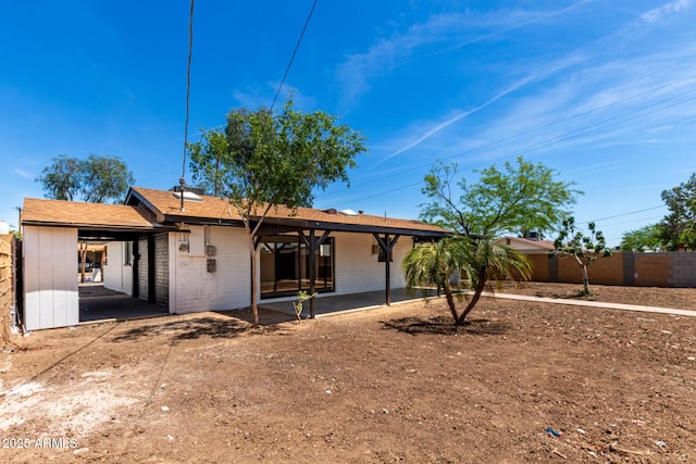 3802 N 48th Dr, Phoenix, AZ 85031 - rear view of property with a patio and fence