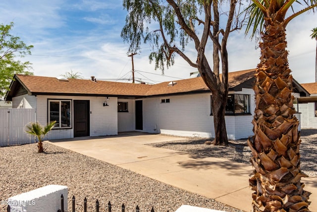3802 N 48th Dr, Phoenix, AZ 85031 - ranch-style house featuring fence, a patio area, and brick siding
