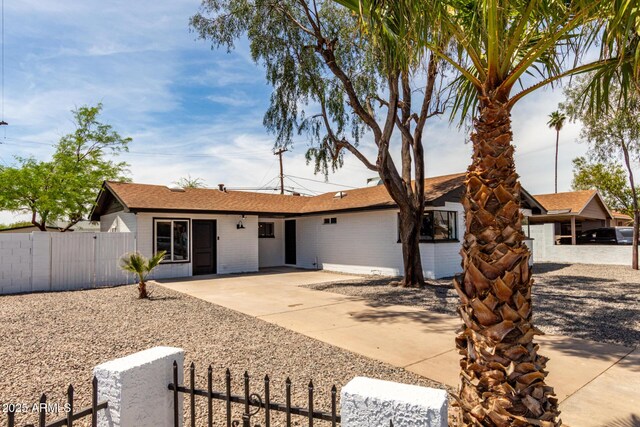 3802 N 48th Dr, Phoenix, AZ 85031 - ranch-style house featuring a gate, a fenced front yard, and brick siding