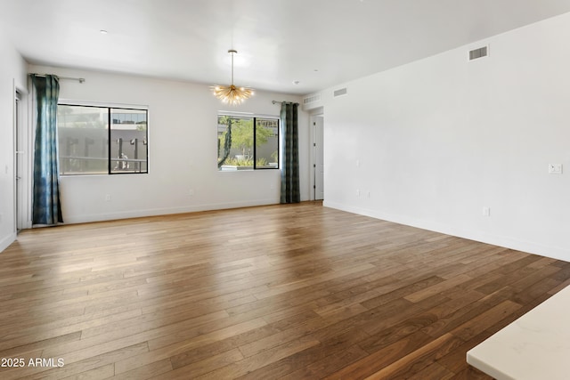 3131 N Central Ave Unit 3009, Phoenix, AZ 85012 - spare room with hardwood / wood-style floors and baseboards