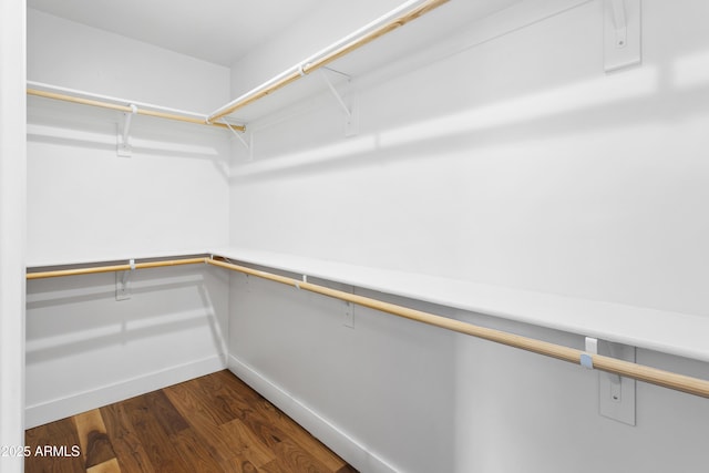 3131 N Central Ave Unit 3009, Phoenix, AZ 85012 - walk in closet featuring dark wood-style floors