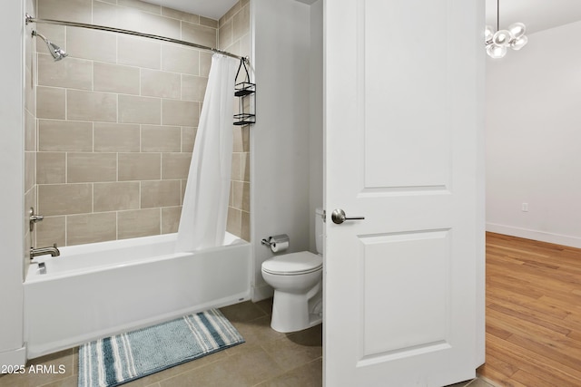 3131 N Central Ave Unit 3009, Phoenix, AZ 85012 - bathroom featuring shower / bath combo with shower curtain, toilet, tile patterned floors, and baseboards