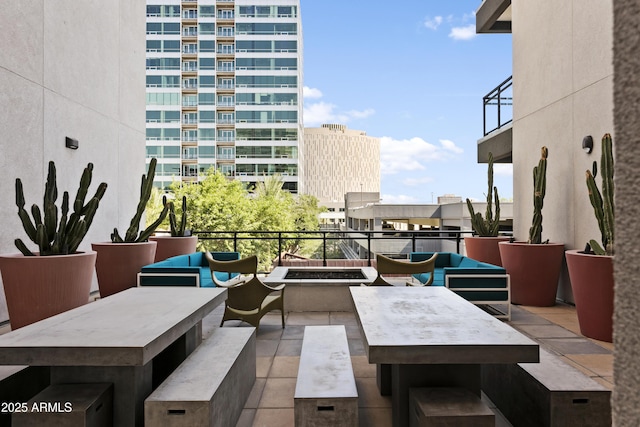 3131 N Central Ave Unit 3009, Phoenix, AZ 85012 - view of patio featuring outdoor dining area, a balcony, and an outdoor living space
