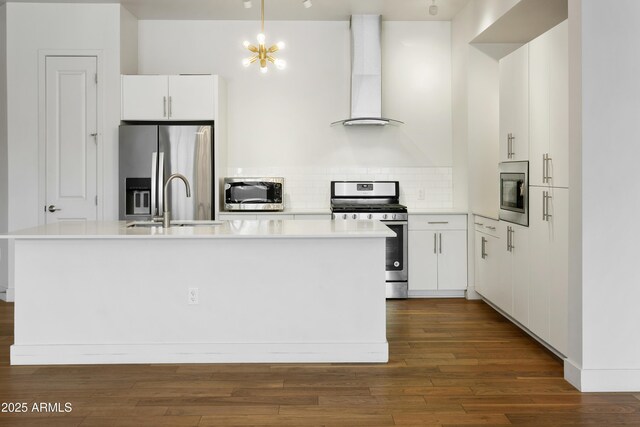 3131 N Central Ave Unit 3009, Phoenix, AZ 85012 - kitchen with stainless steel appliances, wall chimney range hood, a sink, and white cabinetry